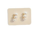 dainty earrings feature three lustrous pearls arranged in a sleek bar design,