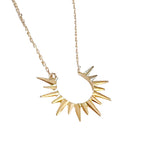 4kt gold-dipped metal, this necklace features a stunning sunburst design 