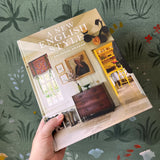 Book titled 'A New English Style' held against a floral-patterned background