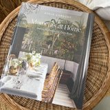 Book titled 'Moments at Home' by Steve Cordony on a woven surface