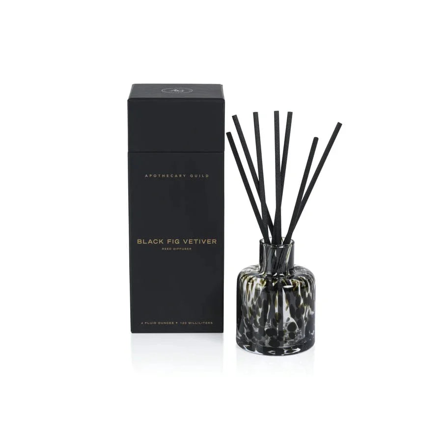Aromatherapy diffuser with black sticks and a black box labeled 'Black Fig Vetiver' on a white background.