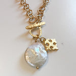 RAW EDGE PEARL AND GOLD CHARM FRONT TOGGLE NECKLACE