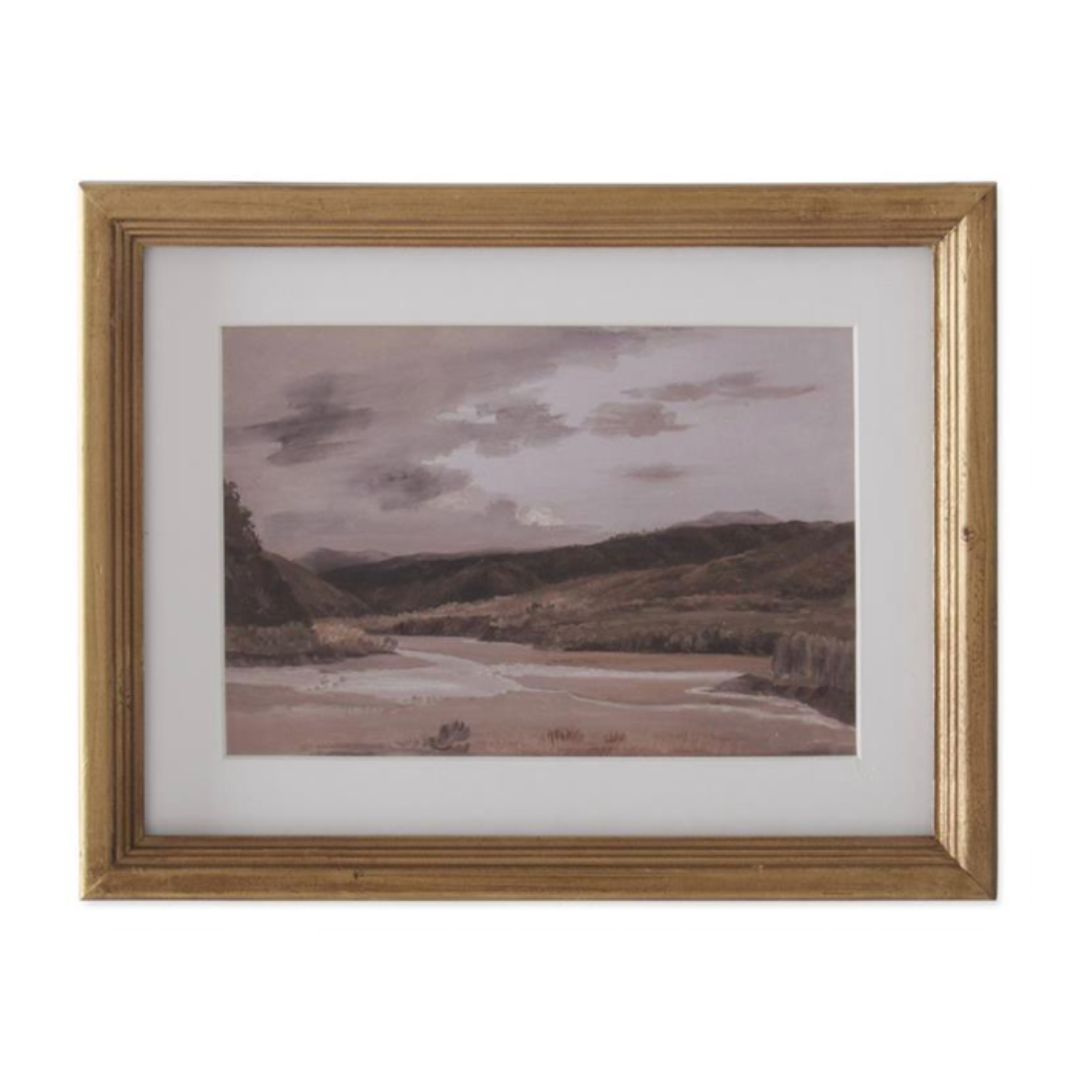 Framed artwork of a landscape with mountains and water.