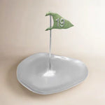 Decorative dish with a green flag featuring the number 19 on a beige background