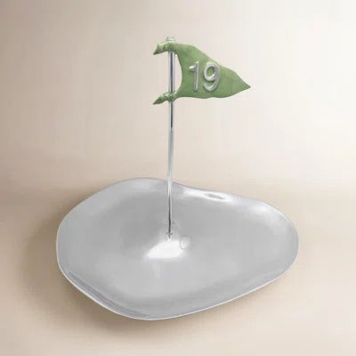 Decorative dish with a green flag featuring the number 19 on a beige background