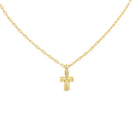 Gold necklace with a small cross pendant on a light gray background