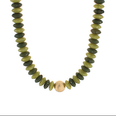 Necklace with green and gold beads on a white background