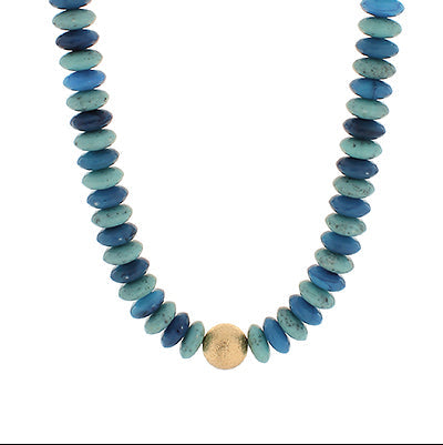 Necklace with blue beads and a gold accent on a white background