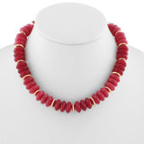 Red beaded necklace with gold accents on a mannequin against a white background