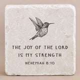 Decorative stone with engraved text from Nehemiah 8:10 and an image of a bird on a beige background