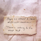 Handwritten quote on a textured paper background