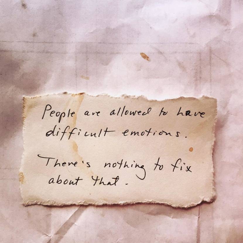 Handwritten quote on a textured paper background