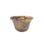 Glass bowl with marbled pattern on a white background