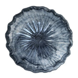 A round, scalloped-edge glass bowl with a textured, sunburst radial pattern in smoky gray and translucent blue tones, shown from a top-down perspective on a white background.