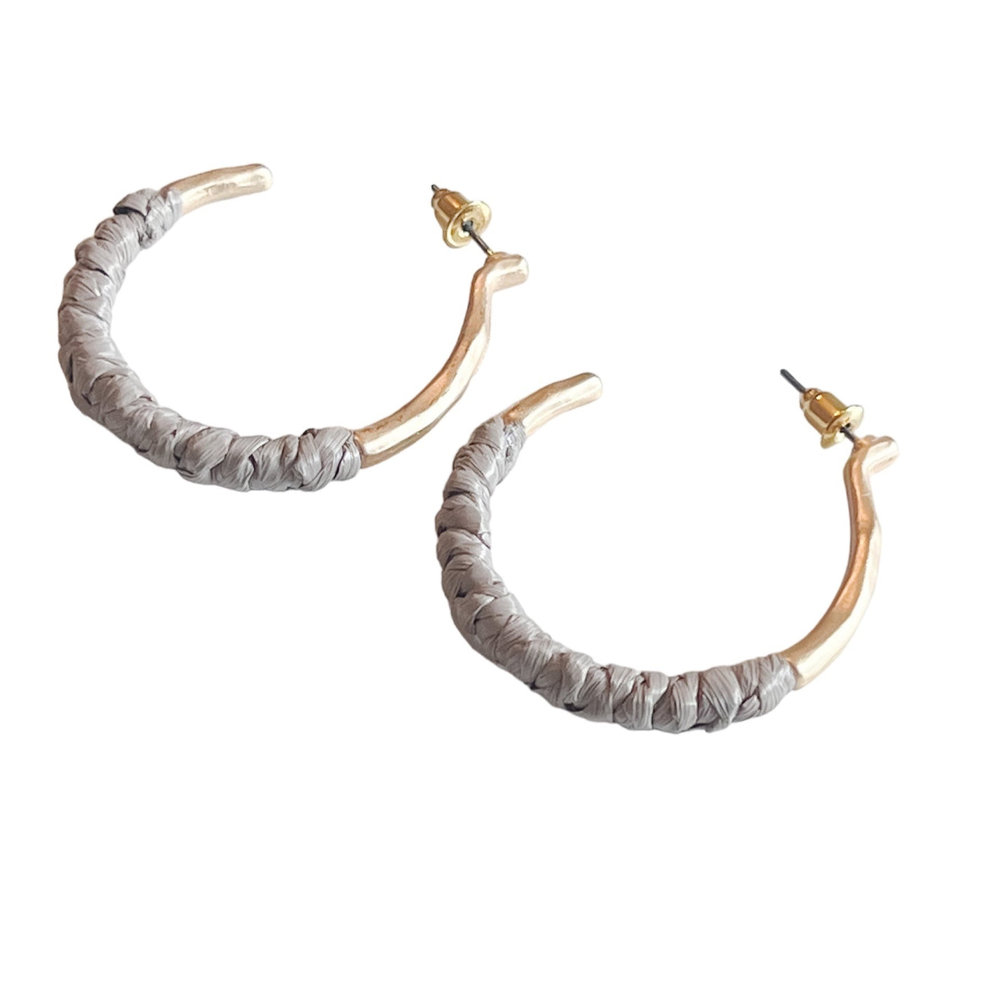 ightweight gold hoops with a comfortable raffia wrap
