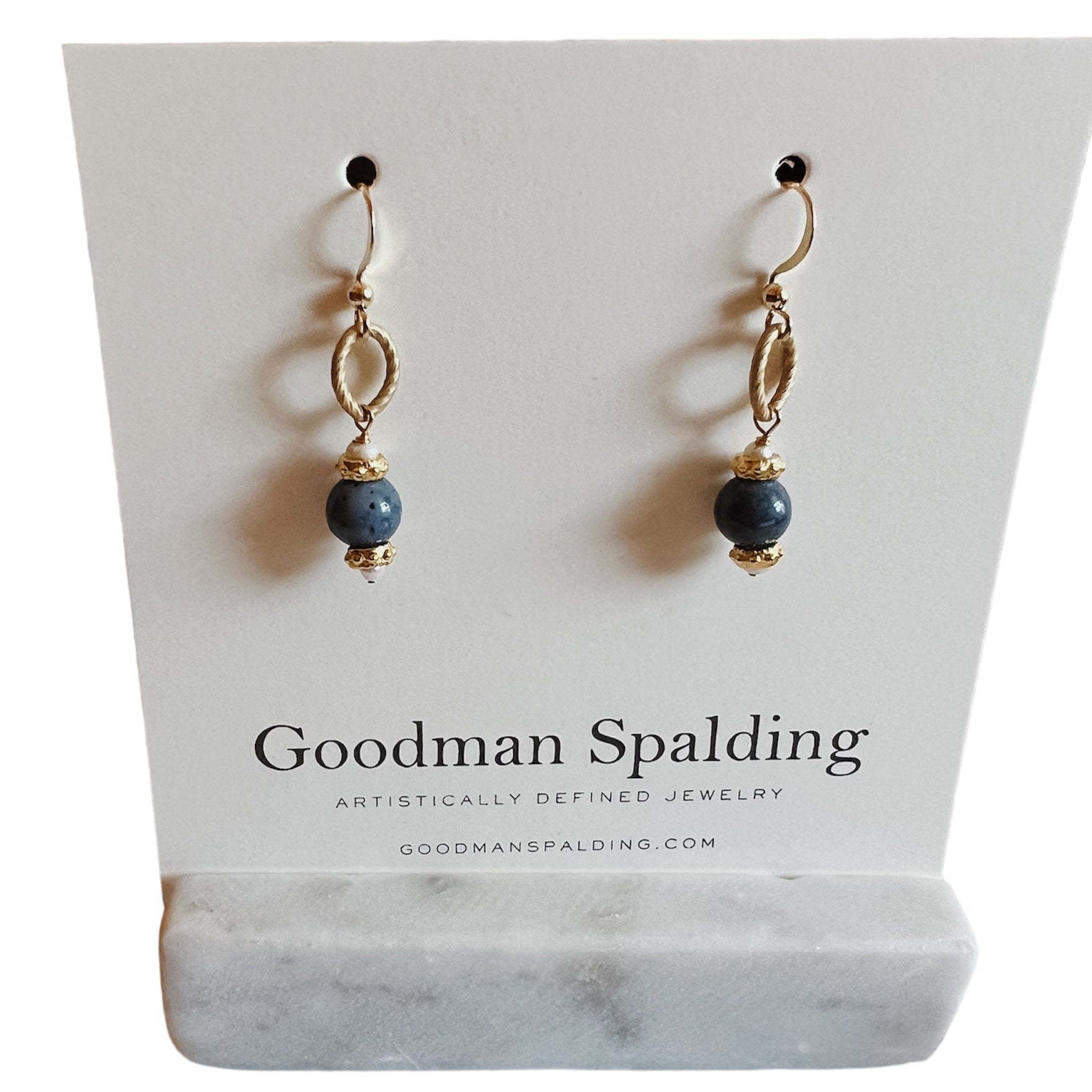 gold dangle earrings with navy ball detail
