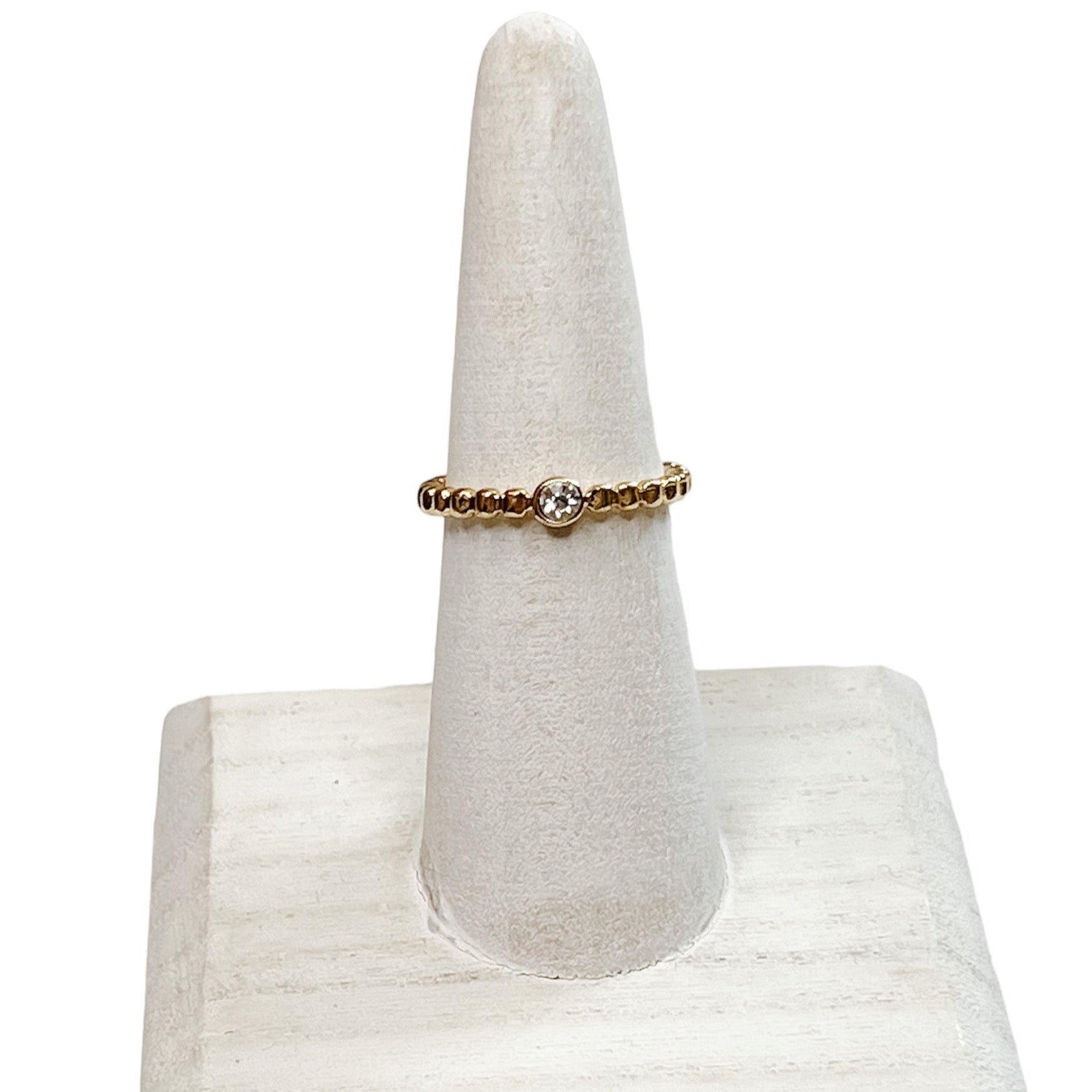 BEADED GOLD RING AND SINGLE CLEAR STONE