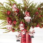 red & white blown glass snowman ornament holding packages