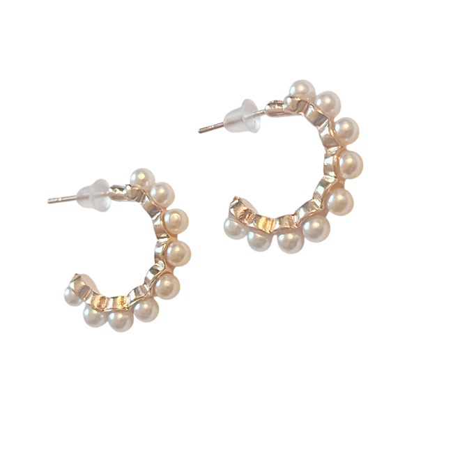 
Product Description:
These elegant pearl-accented hoop earrings combine timeless sophistication with modern flair. Featuring a gold-tone hoop embellished with delicate faux pearls, they are perfect for elevating both casual and formal looks. Lightweight with secure push-back closures, these earrings are a chic addition to any jewelry collection.

Alt Text:
A pair of gold-tone hoop earrings adorned with small faux pearls and push-back closures