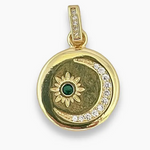 Gold-plated round charm with crystal-studded crescent moon and starburst design featuring a green center stone.