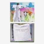 Artistic depiction of a woman in a white dress against a colorful abstract background, with 'Anne Neilson Home' branding.