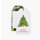 Gift tag with Christmas tree design and 'Merry Christmas' text on a white background