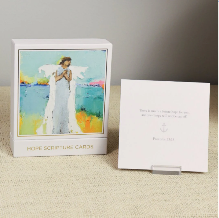 Box of Hope Scripture Cards with an angel illustration on a textured surface