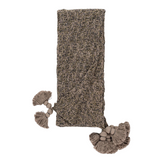Knitted scarf with tassels on a white background