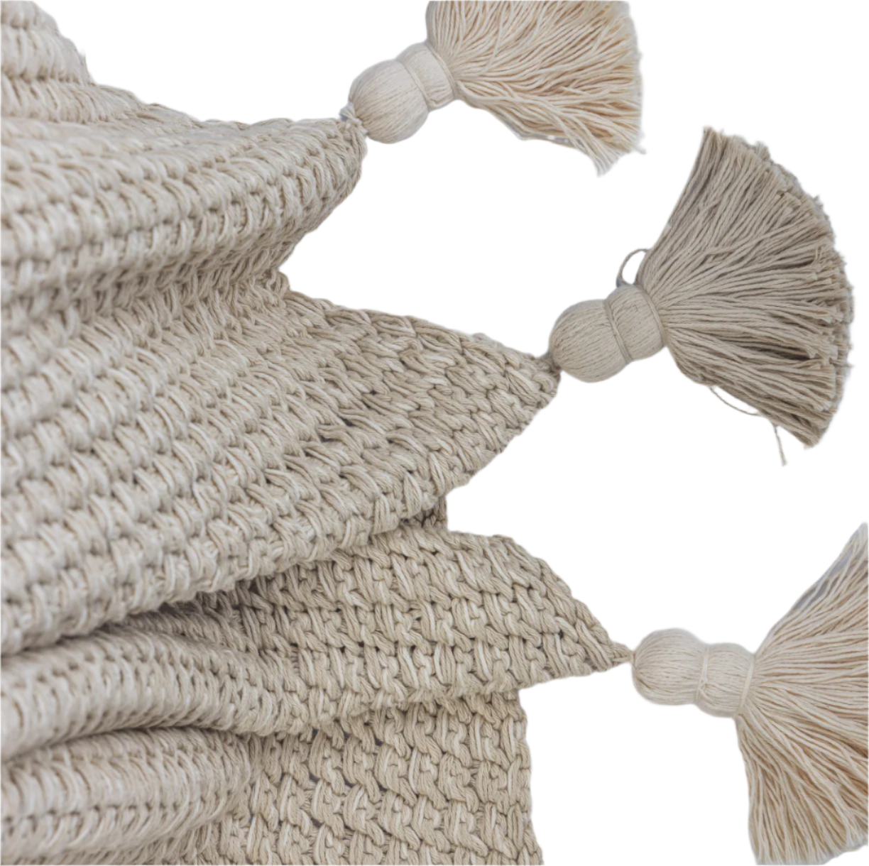 Beige knitted throw blanket with tassels on a white background