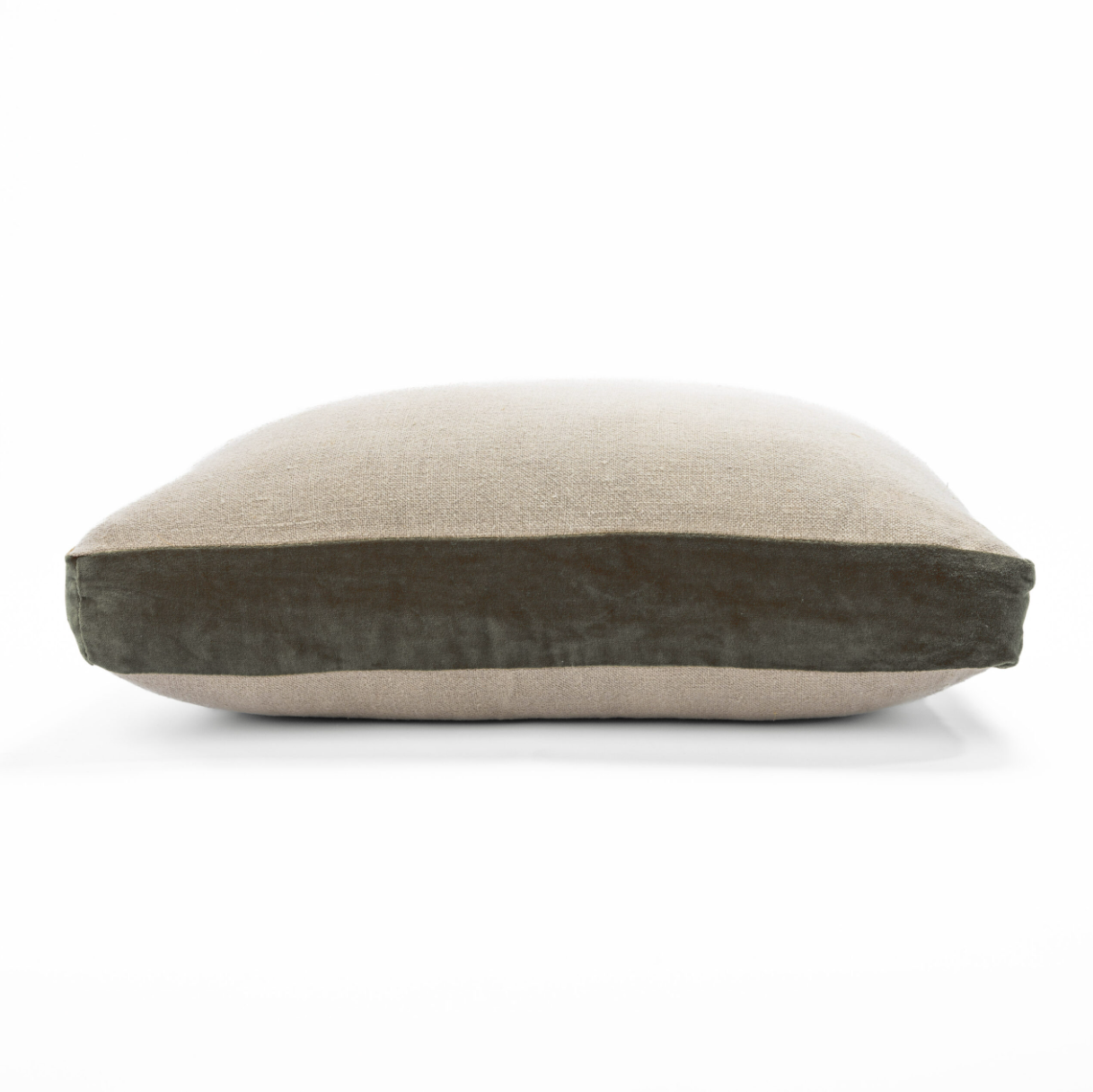 Two-tone pillow with beige top and dark brown bottom on a white background