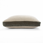 Two-tone pillow with beige top and dark brown bottom on a white background