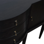 Black dresser with gold handles on a white background