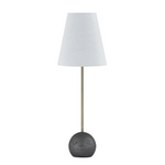 Table lamp with a dark base and white shade on a white background