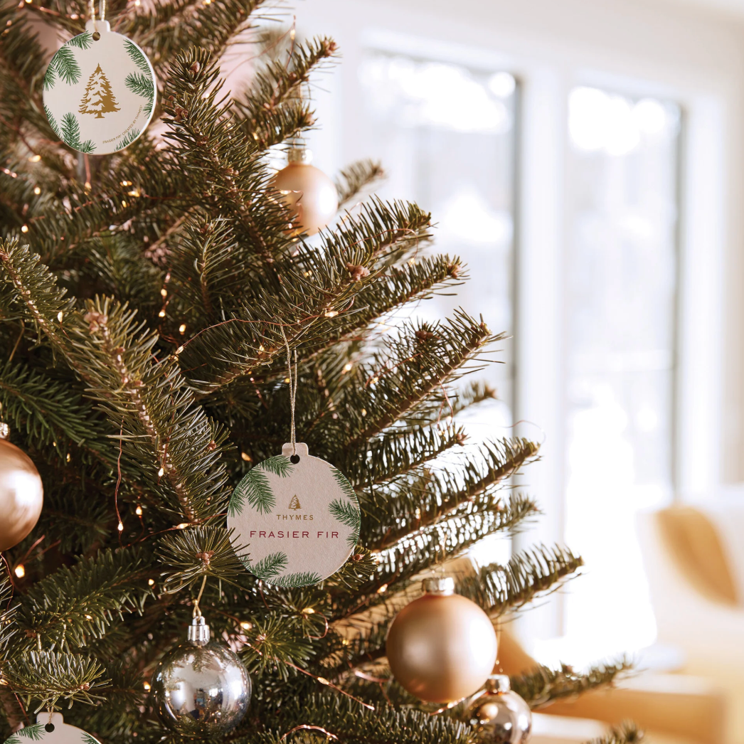 Decorated Christmas tree with ornaments and lights in a home setting