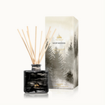 Thymes Noir Woods diffuser with packaging on a white background