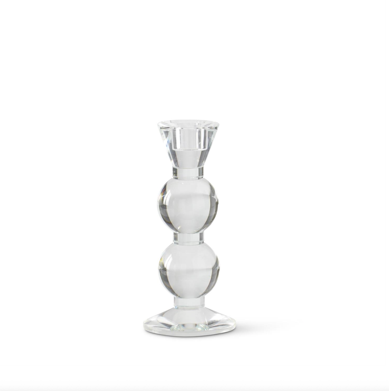 Clear glass taper candle holder on a white background