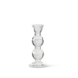 Clear glass taper candle holder on a white background