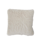 Fluffy white pillow on a light gray background