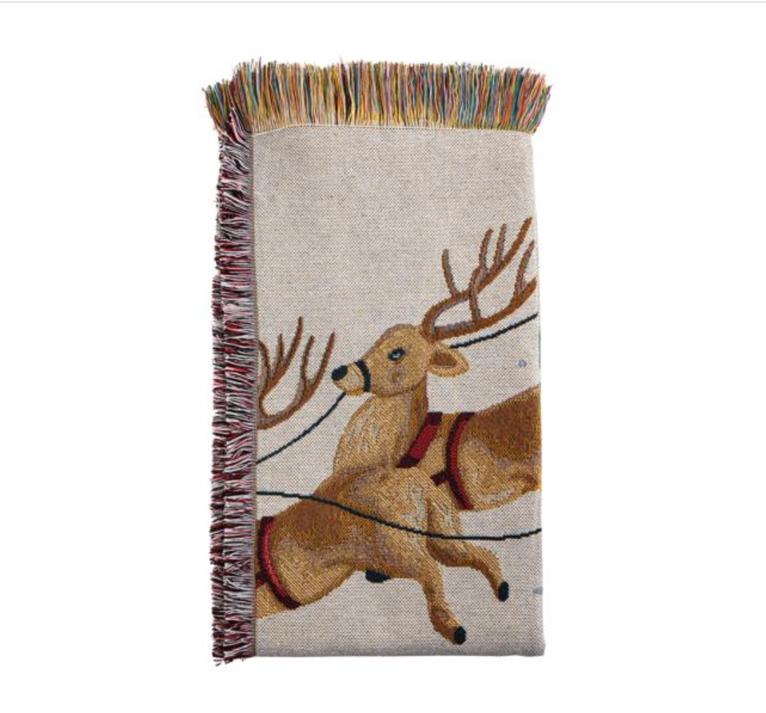 Woven blanket with  reindeer design on a white background