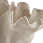 up close view of sculptural sand-textured ceramic bowl