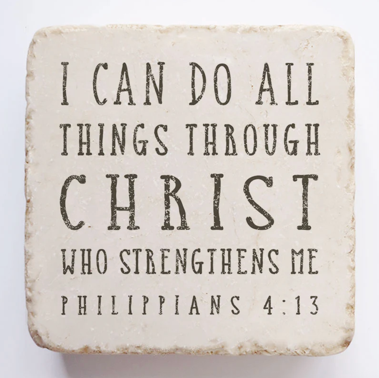 Decorative stone with motivational quote 'I can do all things through Christ who strengthens me' from Philippians 4:13 on a white background.