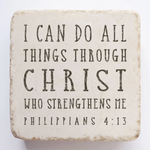Decorative stone with motivational quote 'I can do all things through Christ who strengthens me' from Philippians 4:13 on a white background.