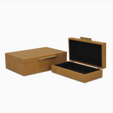 Two brown jewelry boxes with black interior on a white background