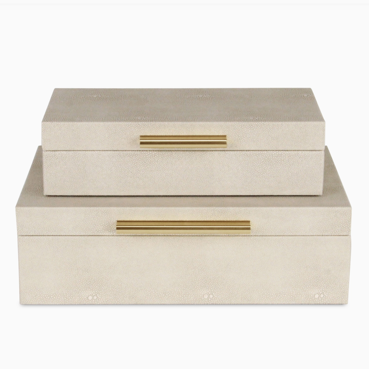 Two beige jewelry boxes with gold handles on a white background