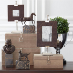 Decorative items including photo frames, sculptures, and boxes on a table.