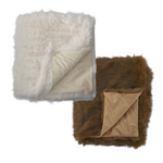 Two fur blankets, one white and one brown, on a white background