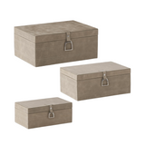 Set of three beige storage boxes with metallic handles on a white background