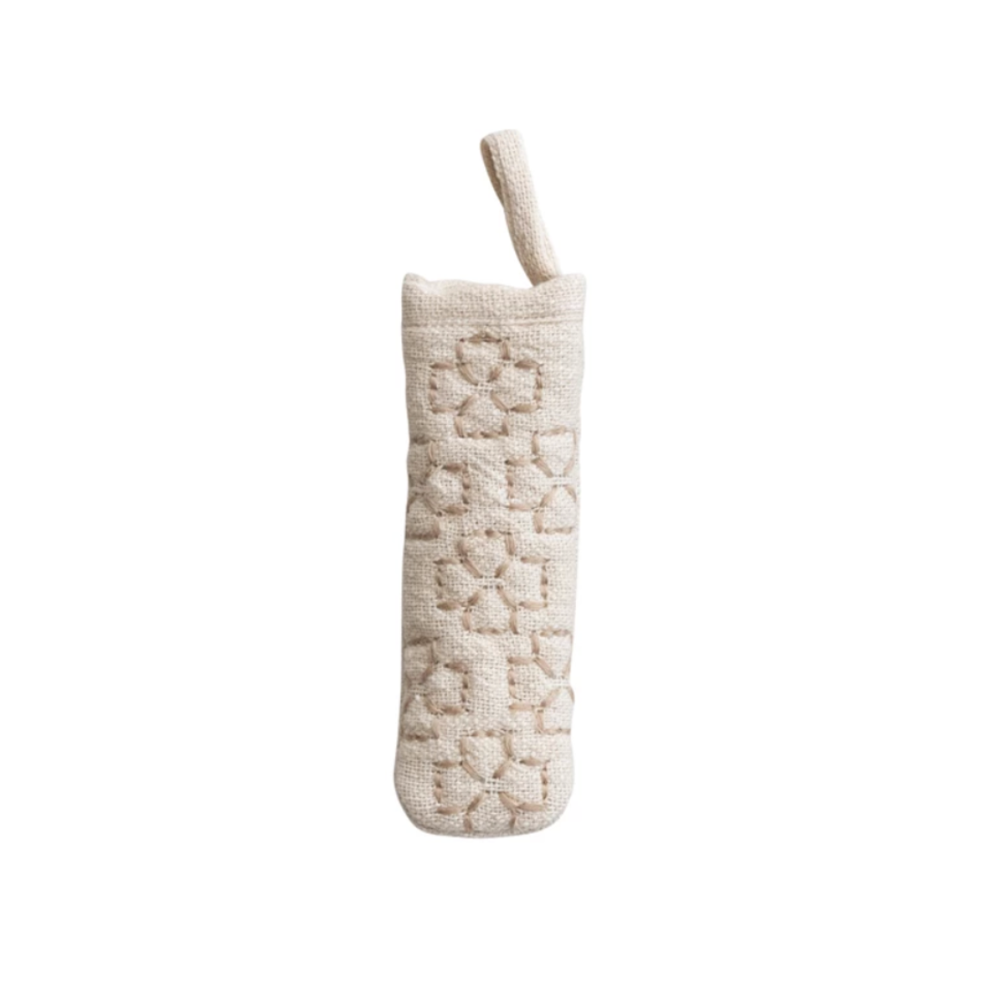 Textured beige pot holder on a white background