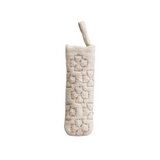 Textured beige pot holder on a white background