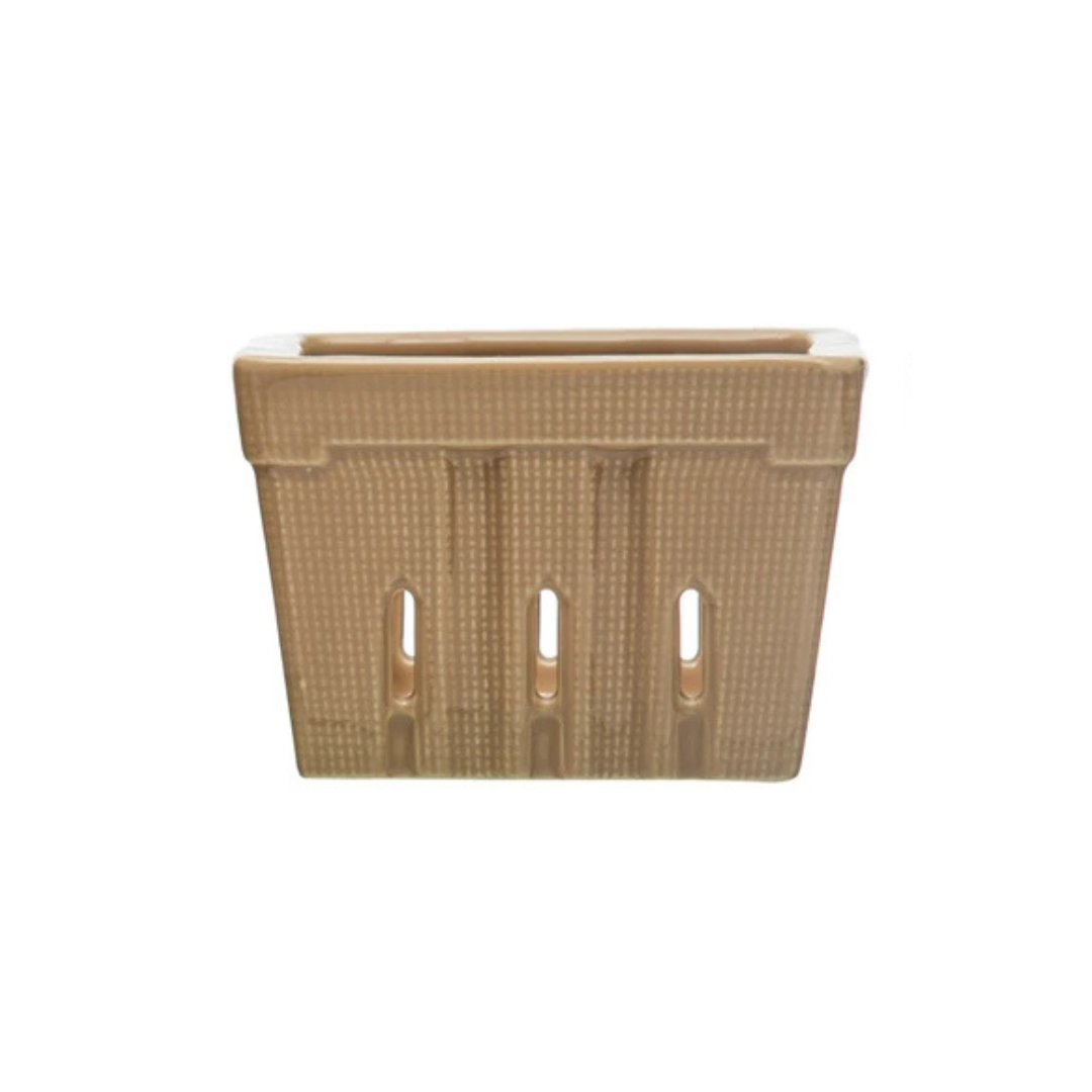 taupe rectangular berry basket with decorative cutouts on a white background